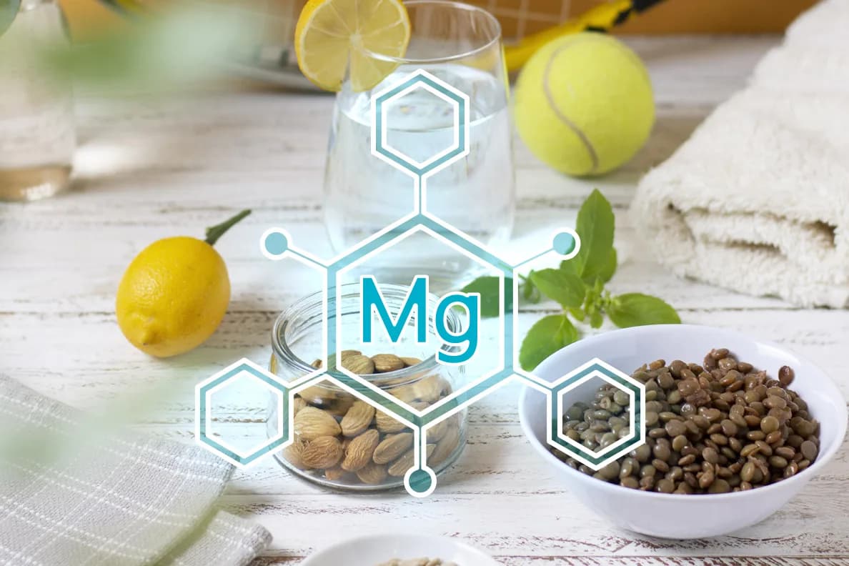 Magnezyum simgesi (Mg) grafiğiyle birlikte badem, mercimek, limon ve bir bardak su